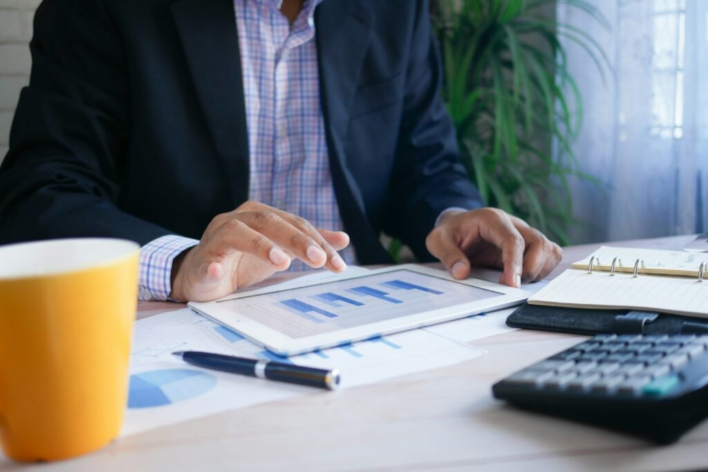 Close-up of a businessperson signing financial documents representing bonds in Florida.